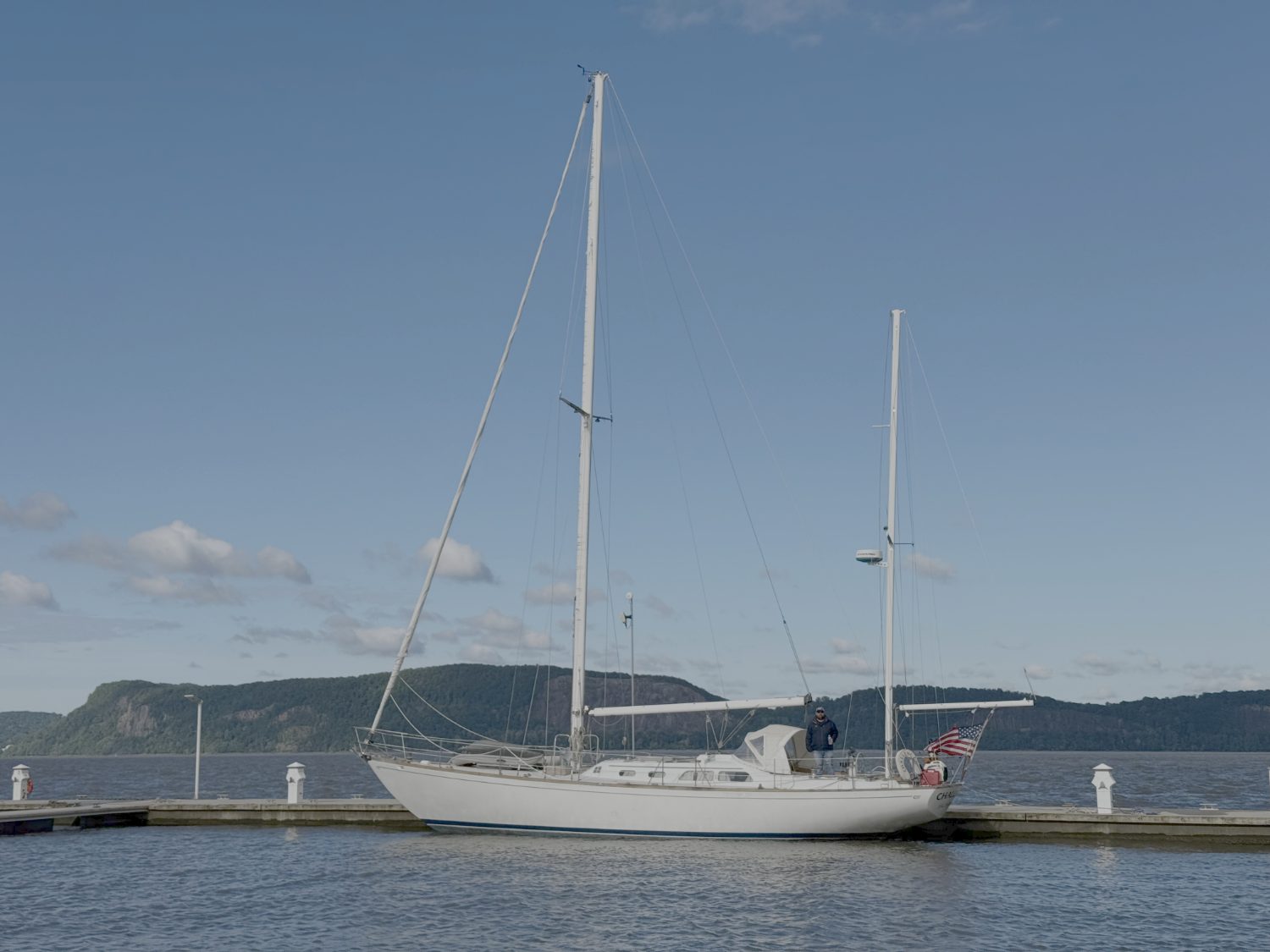 A classic ketch alongside a dock on the Hudson